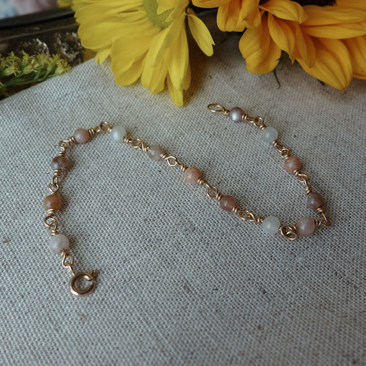 Gold sunstone bracelet with flowers